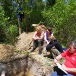 Professor Mark Horton charting and documenting a trench with UoB students.