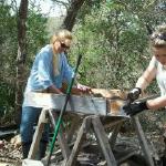 Board Member, Janet Bigney sifting for finds with a UoB student.