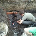 Sumping the water out of the muck.  UoB Graduate student, Phil Wright.