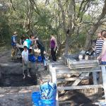 UoB students and Board Member, Scott Dawson on site digging/sifting for finds.